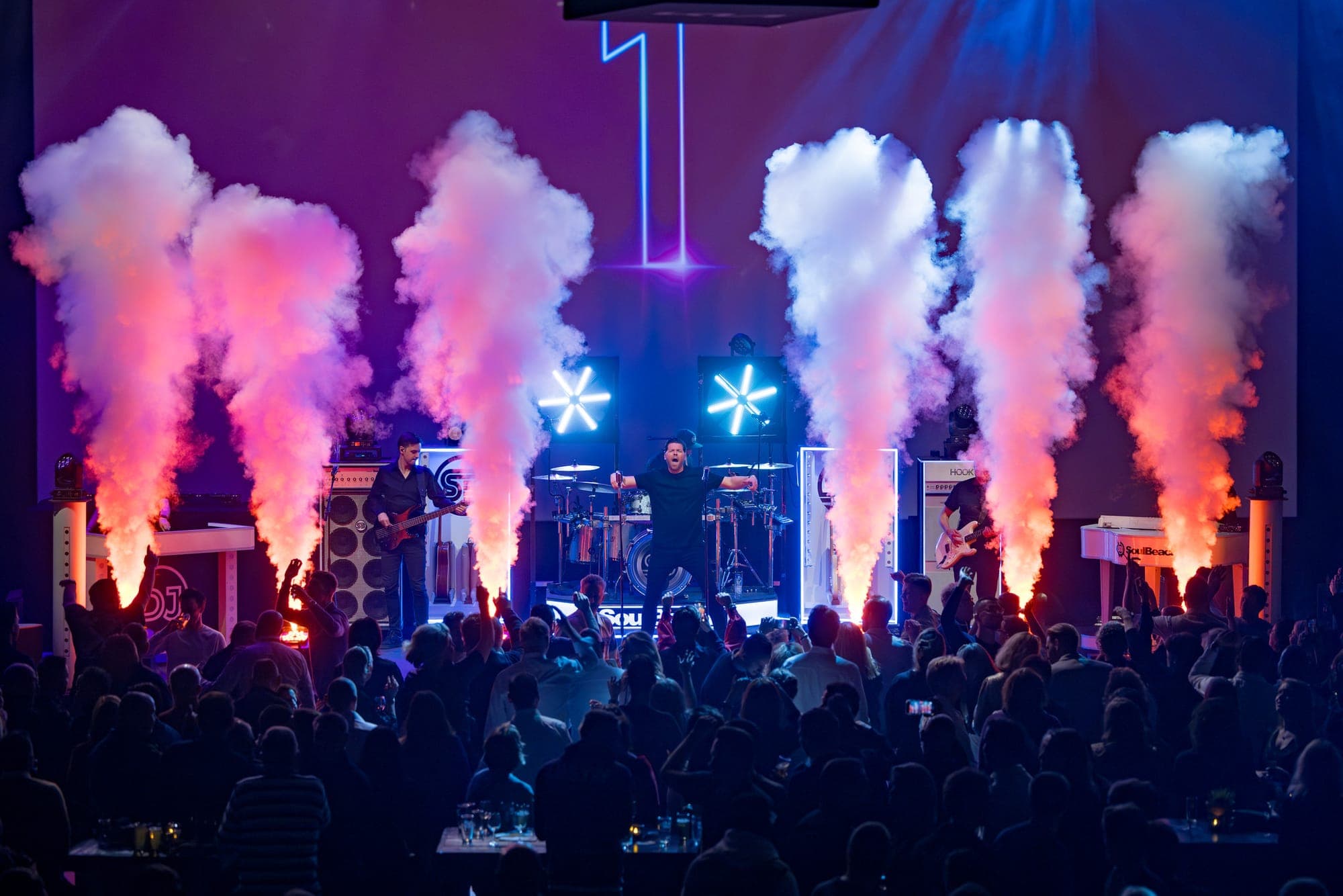 Live performance with smoke effects during a trade show event