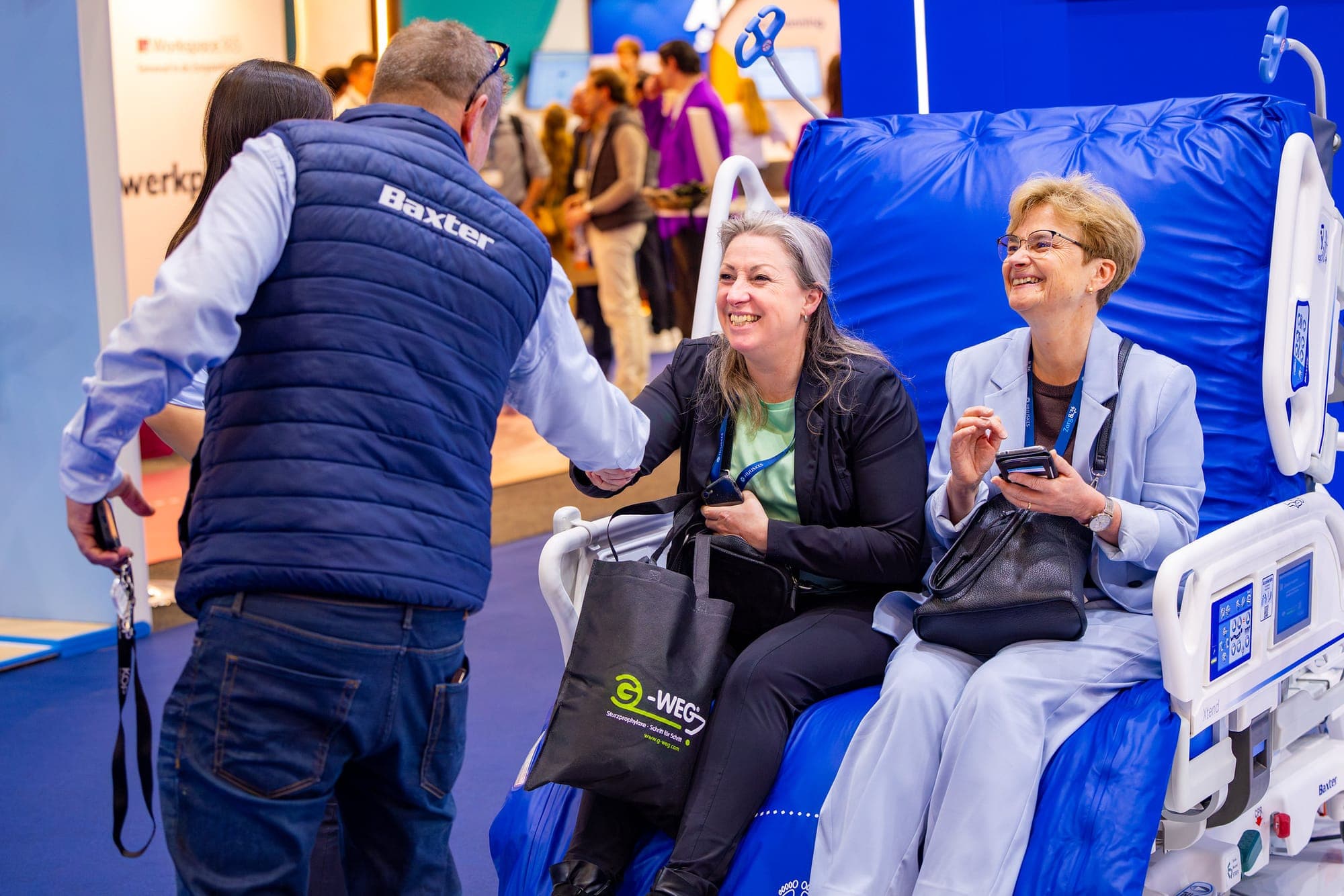 Smiling visitors at a healthcare trade fair